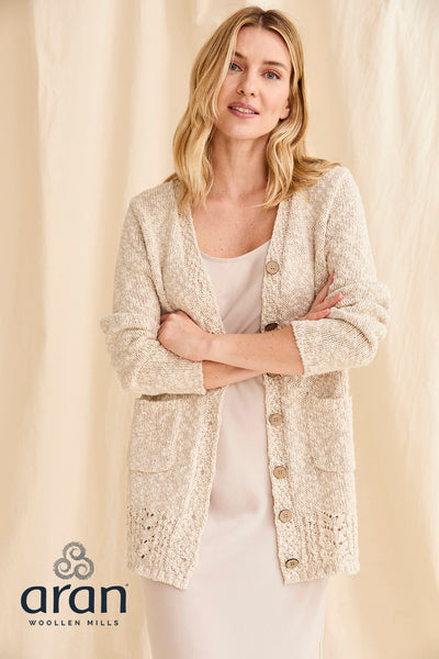 Model wearing Eriu Cotton-Linen Long Line Cardigan - Cream with cardigan open and buttons not done up.