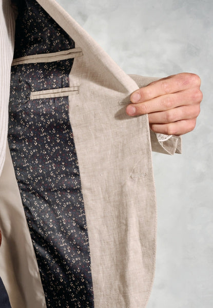 Up close of the Tailored Fit Eastwood Sand Pure Linen Sport Coat, showing inside polyester lining.