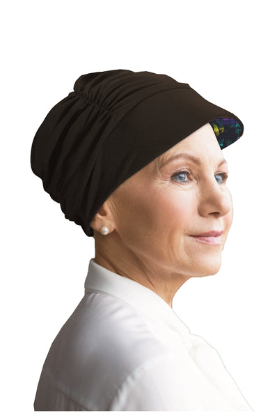 Woman wearing a reversable Watuko Headgear Tigerlily hat in black CAP 2 (240)