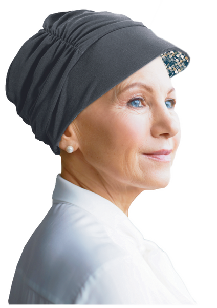 Woman wearing a gray reversable Tigerlily cap by Watuko Headwear in colour grey (CAP 5 (215))