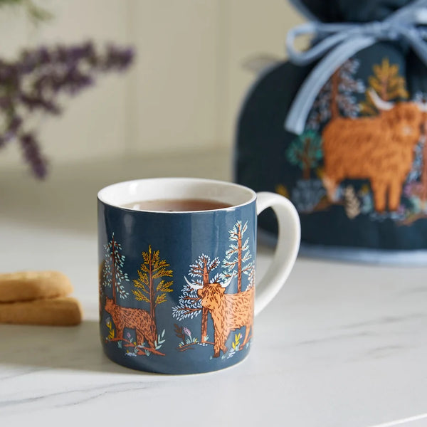 Connie the cow mug set in kitchen on a counter with a drink inside. 
