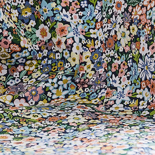 A close up view of the multi-coloured floral pattern on the floral confetti cotton apron