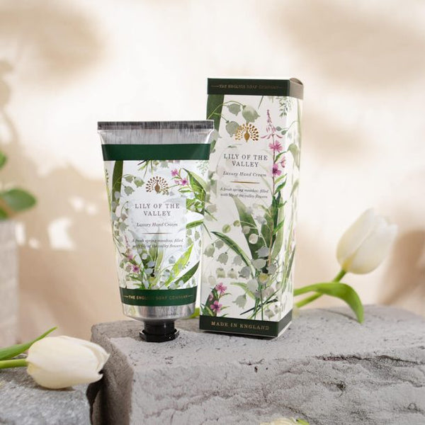 Hand cream with packaging labeled 'Lily of the Valley' on a neutral background