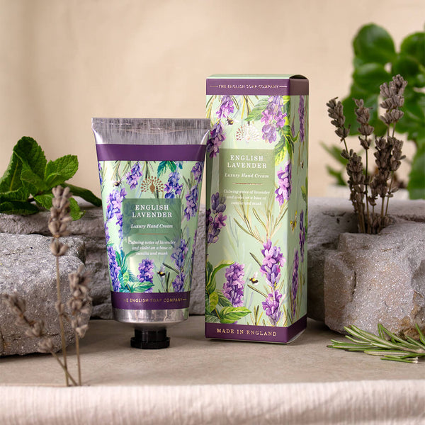 Hand cream and packaging with lavender design on a neutral background