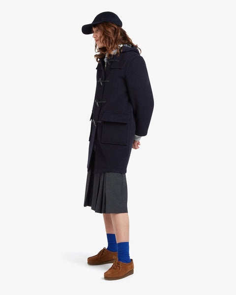 Ladies Gloverall Freda Duffle Coat in Navy Blackwatch - 80% Wool, 20% polyamide oversized coat with tartan lining - side view of coat on model on a white background