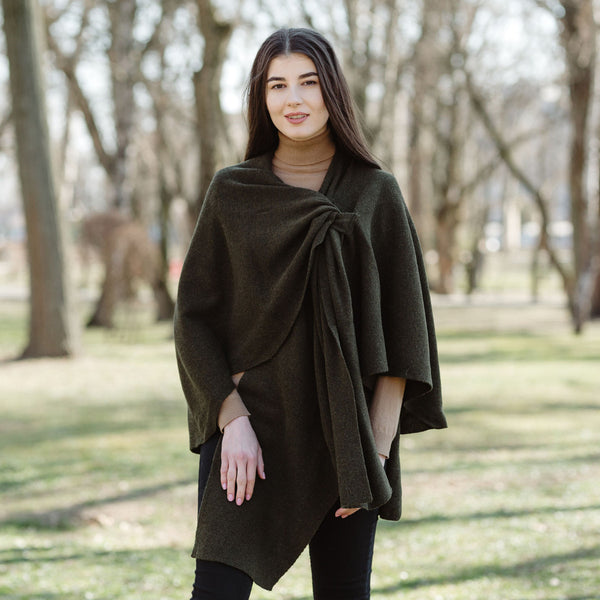 Lady wearing a lambswool draped shawl in army green colour