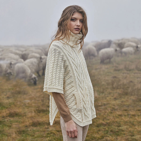 Funnel Neck Poncho in Natural- side view, on model