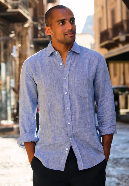 A male model wearing the Brook Taverner Linen Shirt 4591H in light blue.
