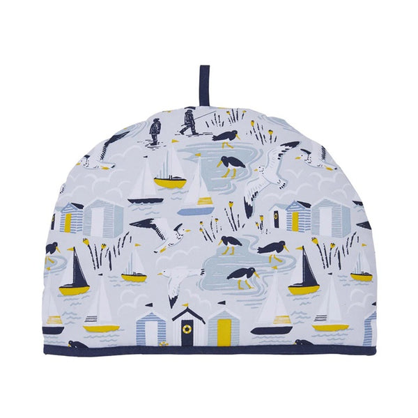 Tea cozy with seaside scene design on a white background