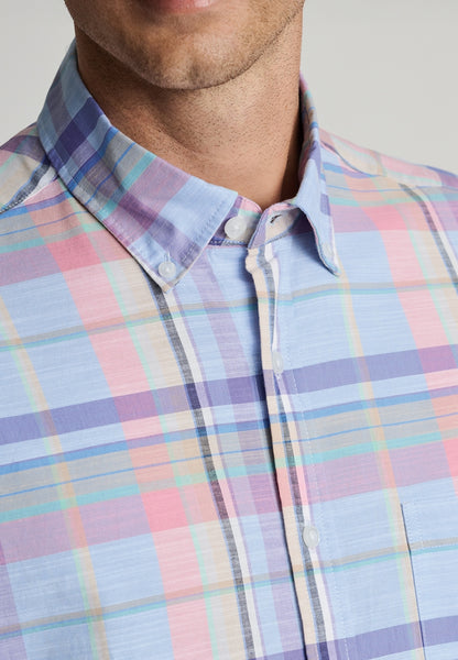 A close up view of the neckline of a model wearing the Regular Fit Sky Blue Check Slub Cotton Short Sleeve Shirt.