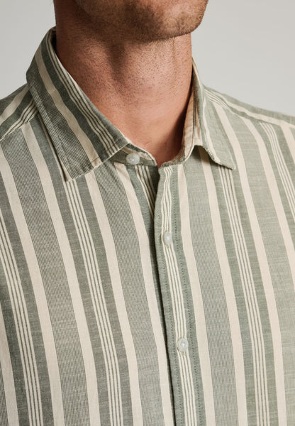 Up close view of neckline of male model wearing the Regular Fit Khaki Cotton Slub Stripe Short Sleeve Shirt