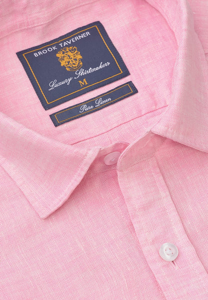 Close-up of a pink linen button-down shirt collar with a visible Brook Taverner neck label.