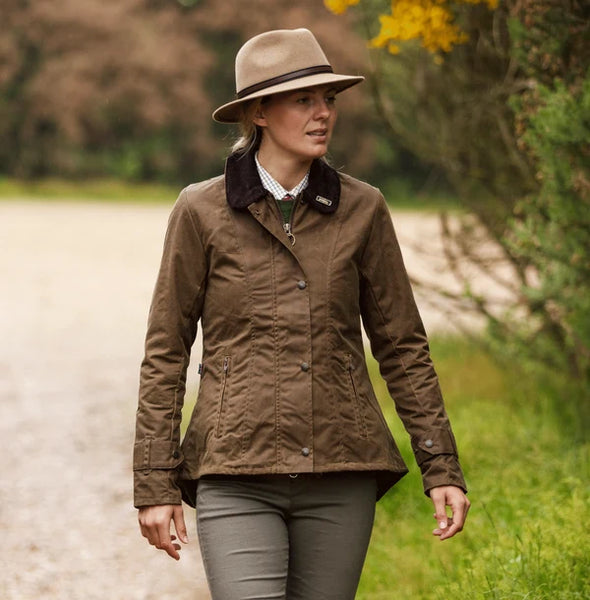 Oxford Blue Ladies Ambre Waxed Jacket  in Sand - 100% Waxed Cotton Jacket with adjustable wrist cuffs and pockets, on model