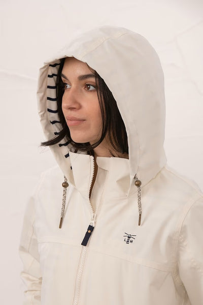 Lighthouse Beachcomber Jacket in Chalk- Waterproof and Breathable Polyester Rain Coat with striped lined hood and pockets, close up on hood details, on model