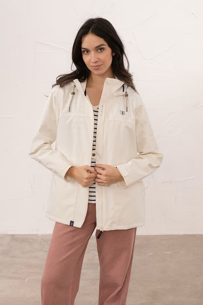 Lighthouse Beachcomber Jacket in Chalk- Waterproof and Breathable Polyester Rain Coat with striped lined hood and pockets, on model