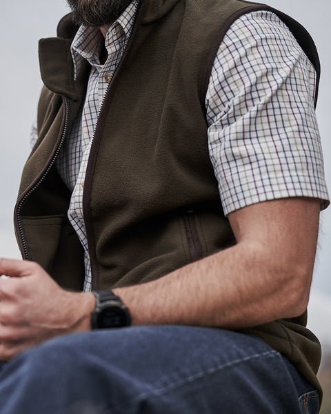 Woodhall Fleece Gilet in olive colour worn by male model  