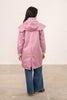 Ladies Lighthouse Outrider Coat in wild rose colour worn by model and shown in rear view