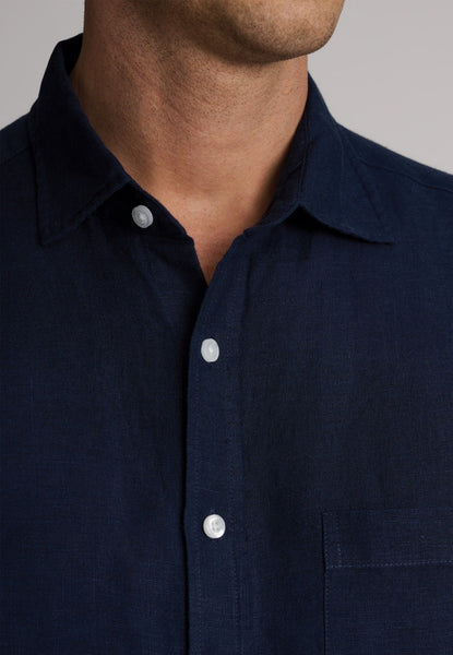 Pure Linen Short Sleeved Shirt on Male Model in Navy Colour with an upclose view of neckline