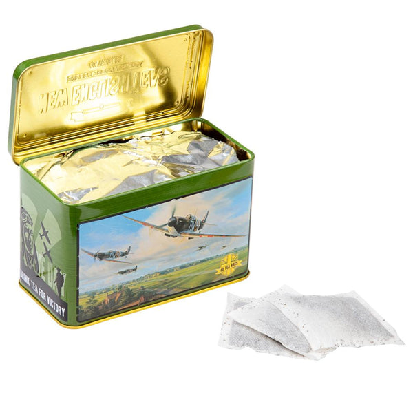 Tea tin with vintage spitfire airplane design and 'New English Tea' branding, tea tin open and showing 3 teabags on white table